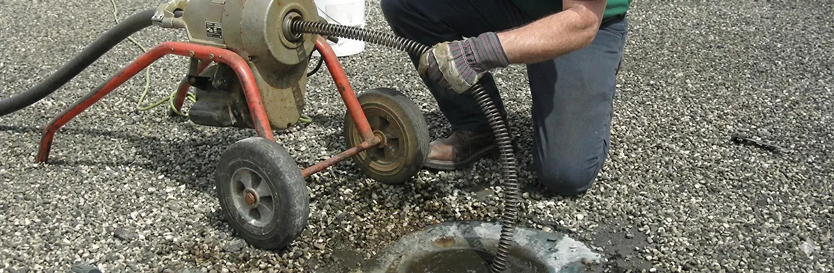 sewer rodding technician actively removing blockages from a sewer line in Omaha, NE